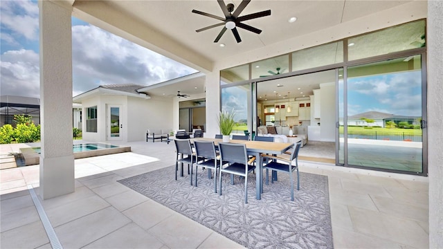 view of patio featuring ceiling fan