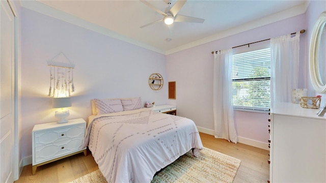 bedroom with ceiling fan and light wood-type flooring