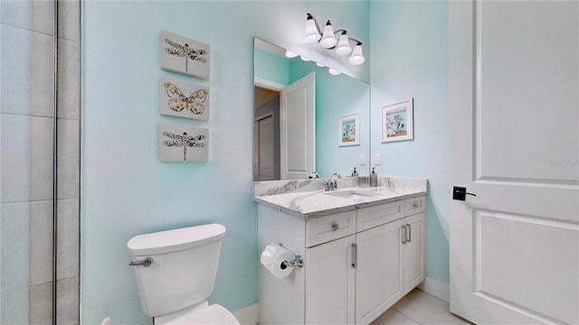 bathroom with tile patterned floors, vanity, and toilet