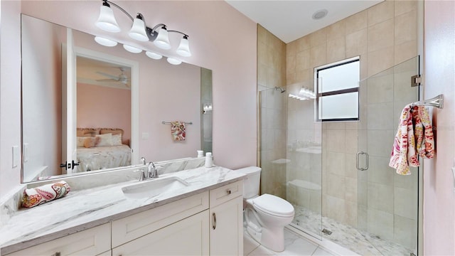 bathroom featuring vanity, toilet, and walk in shower