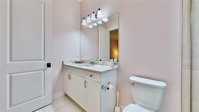 bathroom featuring tile patterned floors, vanity, and toilet