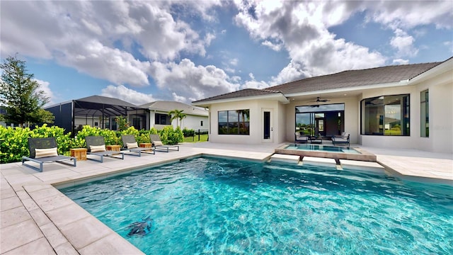 view of swimming pool with ceiling fan and a patio area