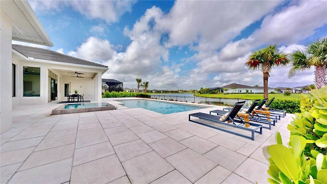 view of pool with ceiling fan and a patio