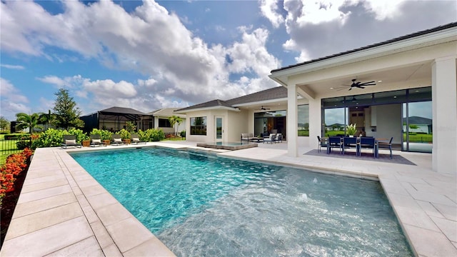 view of pool featuring a patio and ceiling fan