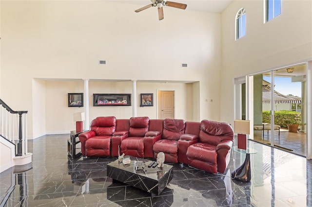 8607 51st Ave W, Bradenton, FL 34210 - living room with marble tiled floors, a high ceiling, ceiling fan, ornate columns, and stairway