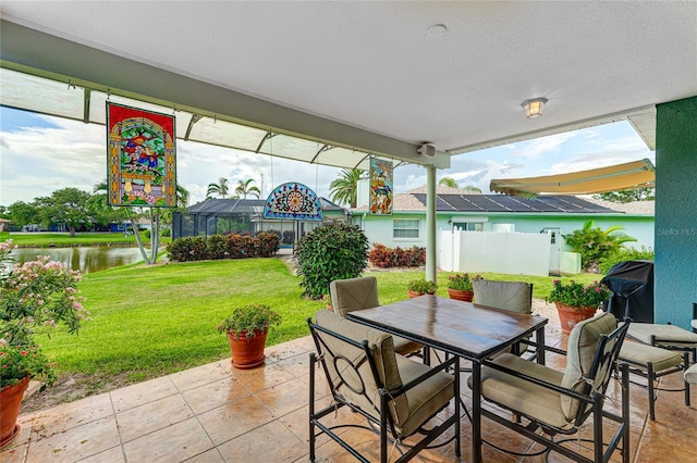 8607 51st Ave W, Bradenton, FL 34210 - view of patio featuring a water view and outdoor dining space