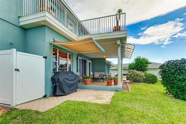 8607 51st Ave W, Bradenton, FL 34210 - view of patio / terrace with a balcony, grilling area, and a gate
