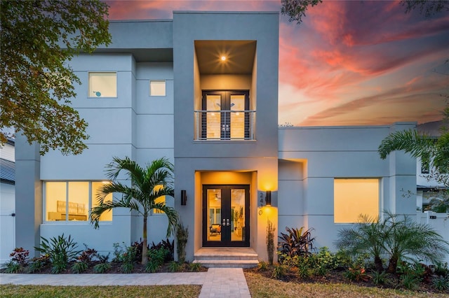 2430 Floyd St, Sarasota, FL 34239 - modern home featuring french doors, stucco siding, and a balcony