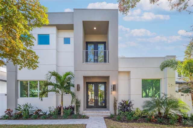 2430 Floyd St, Sarasota, FL 34239 - view of front of home featuring french doors, stucco siding, and a balcony