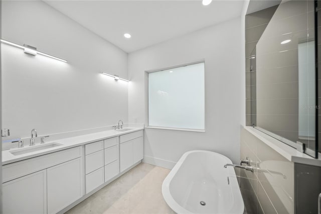 bathroom featuring a tub and vanity