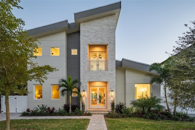 modern home with french doors and a balcony