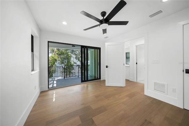 unfurnished room featuring ceiling fan and light hardwood / wood-style flooring