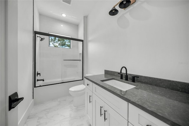 full bathroom with vanity, toilet, and enclosed tub / shower combo