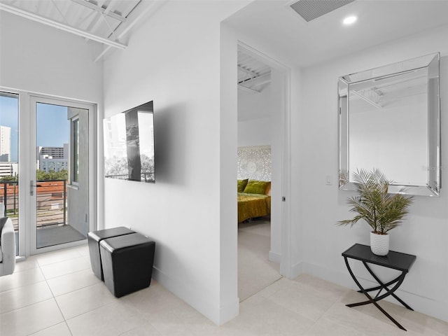 hallway featuring light tile patterned flooring