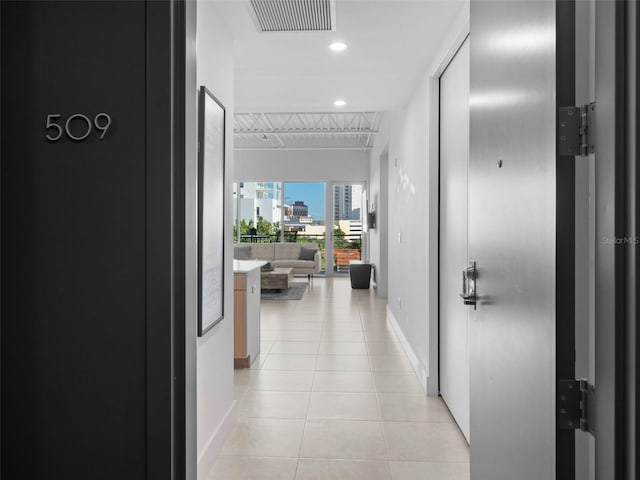 hallway featuring light tile patterned floors