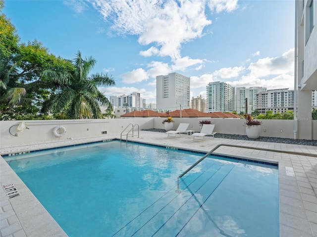 view of swimming pool featuring a patio area