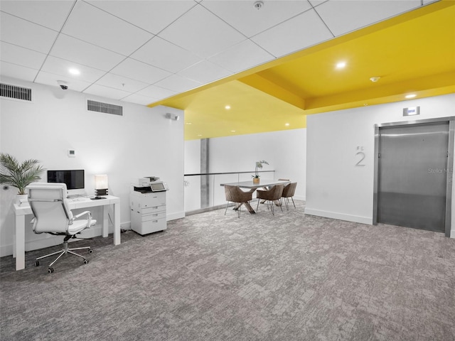 office area featuring elevator and carpet floors