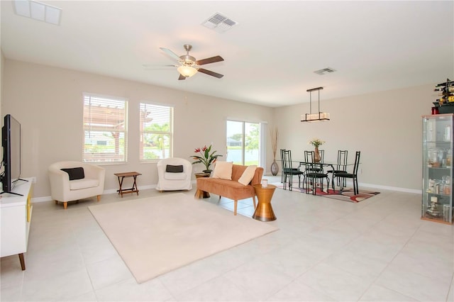 living area with ceiling fan