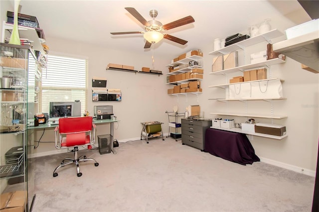 home office with ceiling fan and light colored carpet