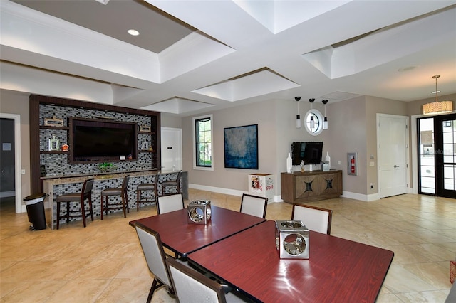 dining area featuring a skylight and coffered ceiling