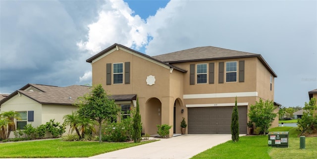 view of front of house with a front lawn and a garage