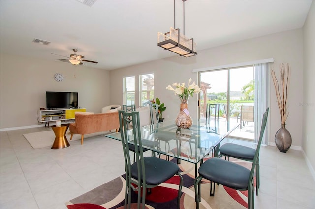 dining area with ceiling fan, a healthy amount of sunlight, and light tile patterned floors