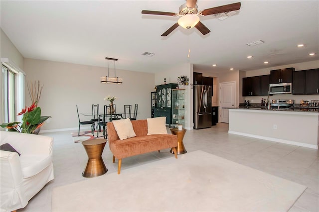 living room featuring ceiling fan