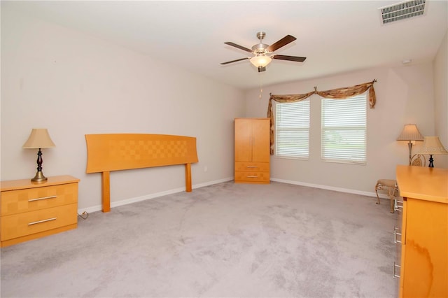 interior space with ceiling fan and light carpet