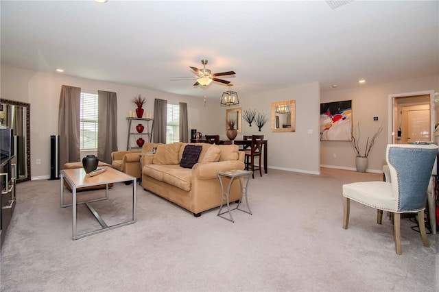 living room featuring ceiling fan and light colored carpet