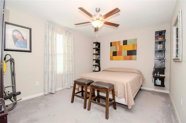 bedroom featuring ceiling fan and light carpet