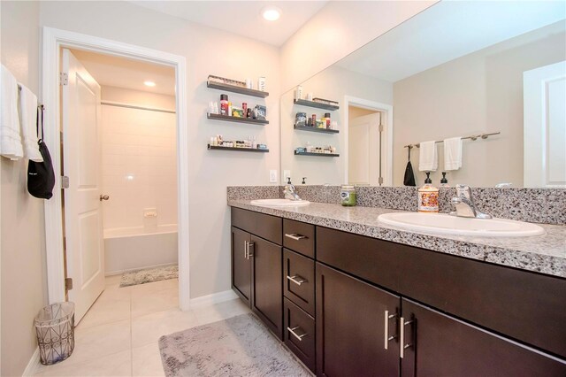 bathroom with tile patterned floors, vanity, and bathing tub / shower combination