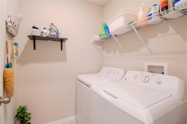 clothes washing area featuring washing machine and clothes dryer