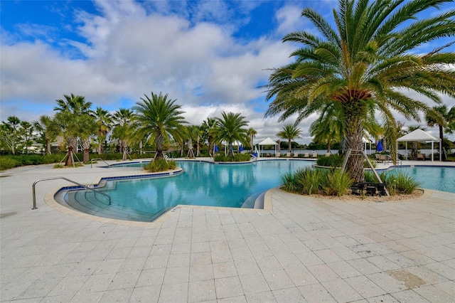 view of swimming pool featuring a patio area and a gazebo