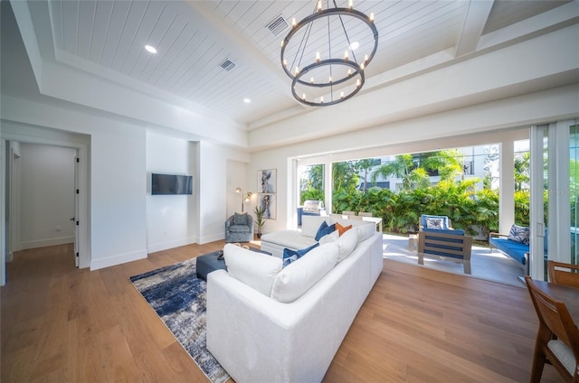 living room featuring a notable chandelier, light hardwood / wood-style floors, wood ceiling, a raised ceiling, and beam ceiling