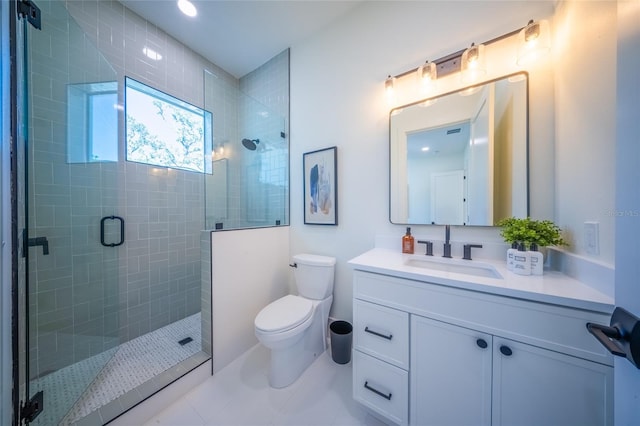 bathroom featuring an enclosed shower, vanity, and toilet