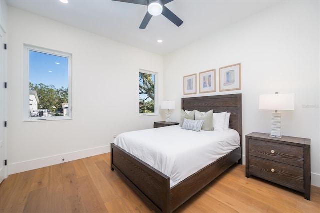 bedroom featuring light hardwood / wood-style flooring and ceiling fan