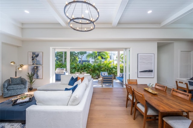 living room featuring an inviting chandelier, hardwood / wood-style flooring, beam ceiling, and wooden ceiling