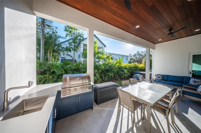 view of patio featuring an outdoor hangout area, area for grilling, sink, and ceiling fan