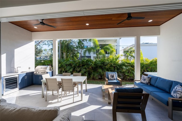 sunroom / solarium featuring wooden ceiling, sink, wine cooler, and ceiling fan