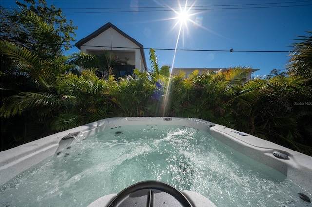 view of pool featuring a hot tub