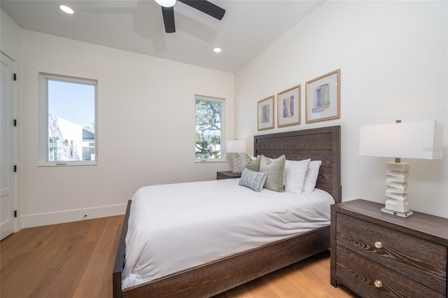 bedroom featuring ceiling fan and light hardwood / wood-style floors