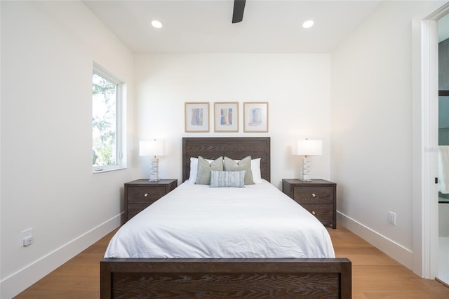 bedroom featuring ceiling fan and light hardwood / wood-style flooring