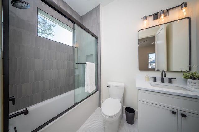 full bathroom with vanity, plenty of natural light, enclosed tub / shower combo, and toilet