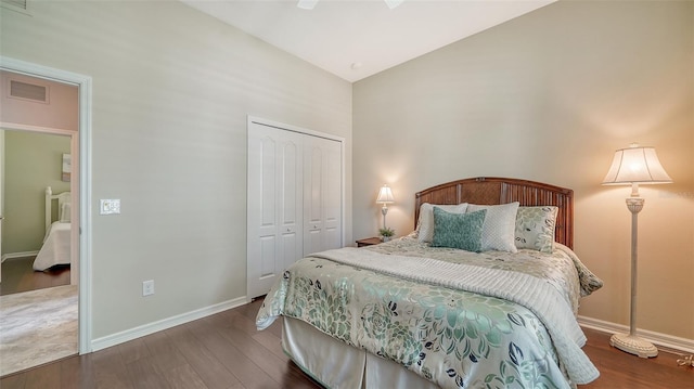 bedroom with ceiling fan, a closet, and dark wood-type flooring