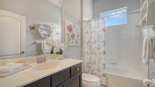 full bathroom with vanity, toilet, and shower / bath combo with shower curtain