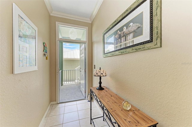 doorway to outside with light tile patterned flooring and ornamental molding