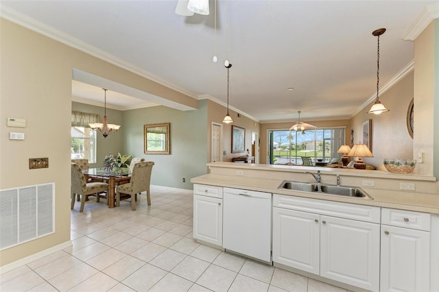 kitchen featuring dishwasher, pendant lighting, and white cabinetry