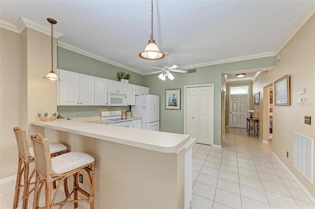 kitchen featuring kitchen peninsula, white cabinetry, white appliances, and ornamental molding