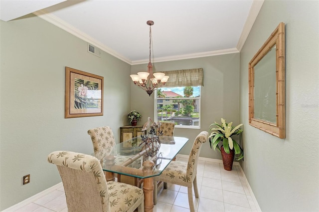 tiled dining space featuring crown molding and a chandelier