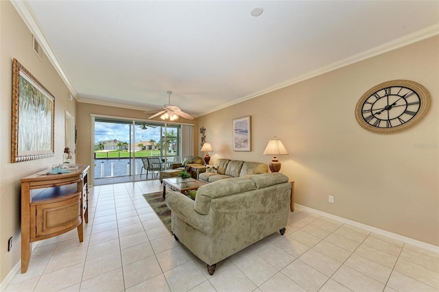 living room with ceiling fan, light tile patterned floors, and ornamental molding